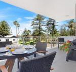 Bathers at the Beach across from Surf Beach - Accommodation Redcliffe